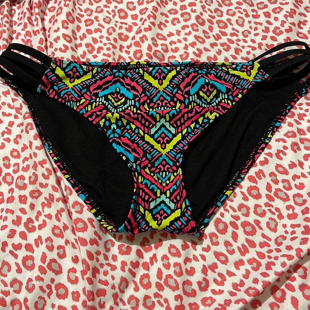 Multicolored vibrant  bright Aztec geometric print cut out bikini bottoms junior